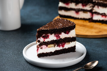 Chocolate cake with raspberry on plate. Slice of cake. Raspberry cake. Wedding dessert. Black forest cake. Delicious dessert. Traditional german dessert