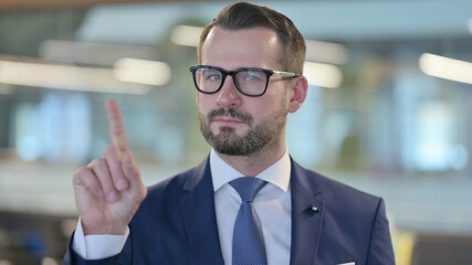 Fototapeta premium Portrait of No Sign by Middle Aged Businessman by Finger Gesture