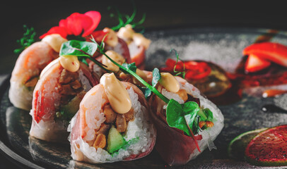 sushi roll in plate on black wooden table background