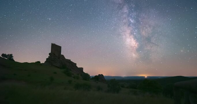 Milky way timelapse during  night in Zafra Castle, Guadalajara, Spain. famous game of thrones location.