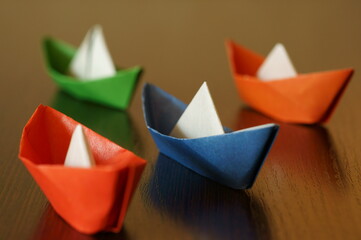 A group of colorful paper boats.