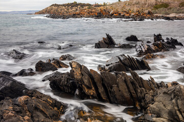 Obraz premium A long exposure of the rock formations along the coastline in Penneshaw Kangaroo Island South Australia on May 12th 2021
