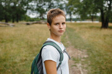 Naklejka premium A person in nature, walking in the forest, active recreation