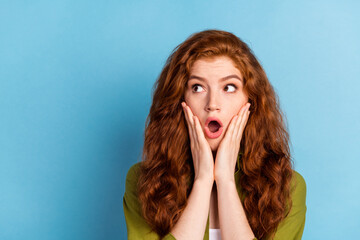 Portrait of attractive amazed girl good news sale reaction look copy blank space isolated over pastel blue color background