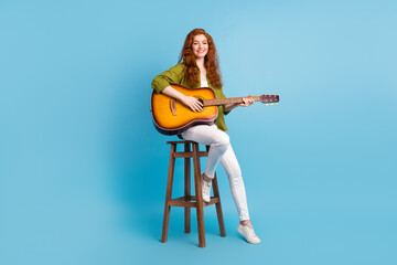 Full length body size view of pretty cheery girl playing guitar pop singing isolated over pastel...