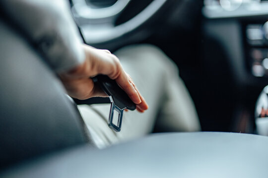 Seat belt about to be used, during a car drive.