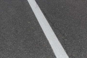 White line and asphalt road. White line on the asphalt road.