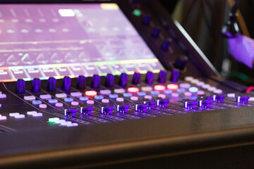 close-up of lighted mixing desk