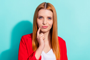 Photo of sweet dreamy orange hair woman dressed red jacket finger chin isolated cyan color background