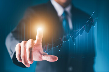Businessman hand show Stock chart showing rising stock sign with graph indicator. Interest rate financial and mortgage rates concept. Double Exposure Image. Blue technology background high tech.