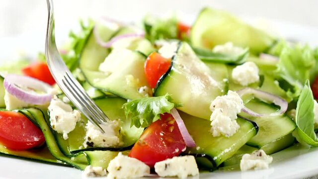 zucchini salad with feta cheese and tomato