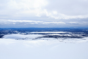cloudy sky and arctic winter landscape from the mountain above the Arctic Circle in Russia