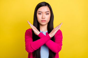 Photo of strict brunette hair young lady crossed arms wear pink sweater isolated on yellow color...