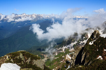 landscape with forest valley and clouds in caucasus mountains