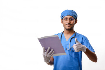 Fototapeta premium Young indian Doctor with a stethoscope notepad and showing thumb