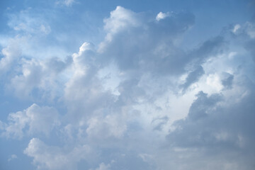 Summer blue sky at sunset with clouds near the coast. Vector clouds texture