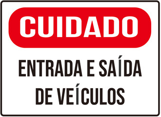 A sign that says in Portuguese language : caution entry and exit of vehicles