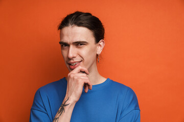 Portrait of a pensive confused young white casual man