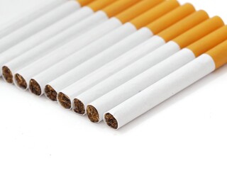 Close up of a cigarettes and the tobacco leaf that is in the cigarettes