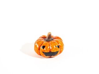 Happy Halloween, pumpkin and leaves on a white background. 