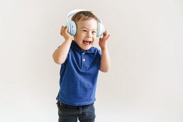 Boy with down syndrome in headphones screaming at camera
