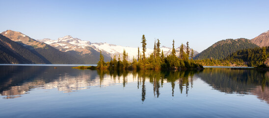 Panoramic View of Canadian Nature Landscape with rocky islands and mountains in the background....