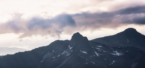 Aerial view from Airplane of the Iconic Mountain, Lions Peak. Colorful Sunset Sky Art Render. Howe Sound, North of Vancouver, British Columbia, Canada.