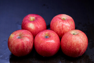 pile of ripe apple isolated on black background