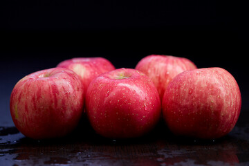 pile of ripe apple isolated on black background