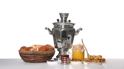 Fototapeta premium Traditional Russian samovar with treats isolated on white