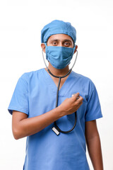 Handsome male doctor standing on white background.