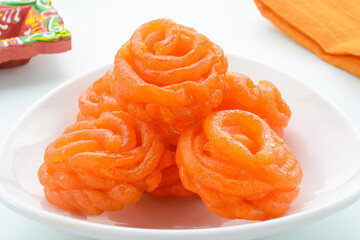 Jangiri also known as Imarti is Indian dessert prepared by frying spiral shaped dough and soaked in sugar syrup.