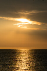 Sunset with clouds at sea