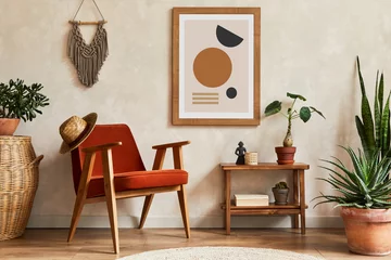 Fotobehang Boho Creative composition of stylish living room interior with mock up poster frame, armchair, coffee table, cacti and personal and boho accessories. Plant love and nature concept. Template.  © FollowTheFlow