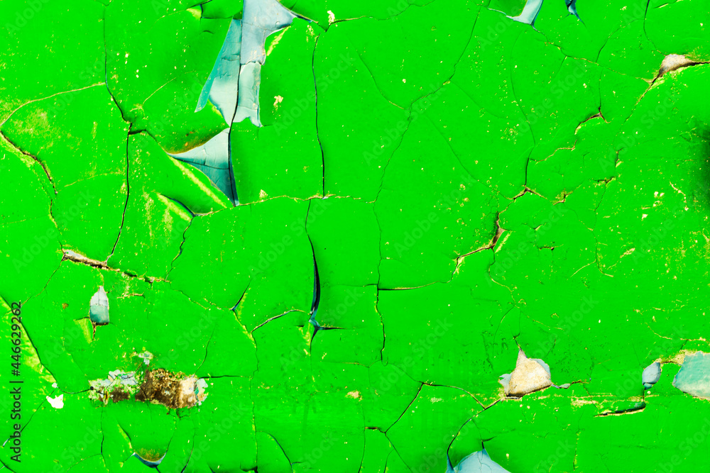 Poster wall with green paint in cracks. background for design. grunge texture
