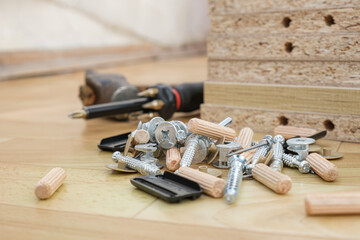 Screwdriver with removable nozzles and parts for assembling furniture on parts of cabinet furniture...