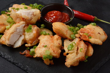 Golden crispy fried chicken fillet. Fried chicken pieces lightly battered, deep fried food