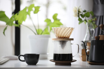 Black coffee cup and coffee drip pot