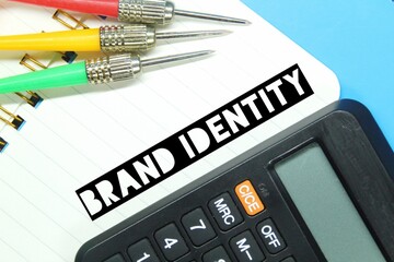 arrows, notebooks, calculators with the word brand identity