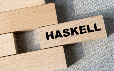 The Haskell programming language. Haskell code on wooden blocks