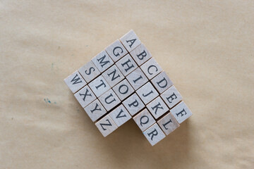 wooden alphabet rubber stamp set on plain paper