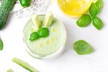 Green gazpacho with fresh cucumber, yogurt, herbs, garlic and olive oil served in glass. Spanish cold soup