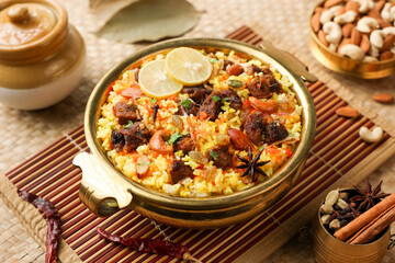Beef Biryani Mutton biryani , Gosht or lamb biriyani Hyderabadi Dum biriyani with raita yoghurt dip special occasion Indian festival food Ramadan , Eid Hyderabad Kerala India Sri Lanka. Lankan food.	