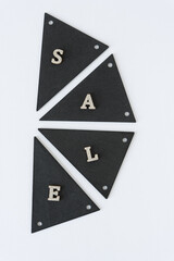 retro black chalk tags arranged in a semi-circular pie with glittery wooden letters and the word 