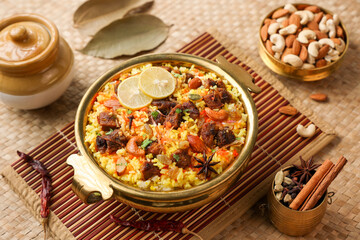 Beef Biryani Mutton biryani , Gosht or lamb biriyani Hyderabadi Dum biriyani with raita yoghurt dip special occasion Indian festival food Ramadan , Eid Hyderabad Kerala India Sri Lanka. Lankan food.	