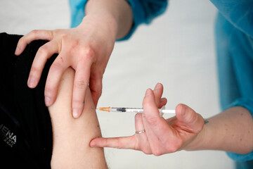 COVID-19 vaccination center, man receiving his first Covid 19 vaccination, France
