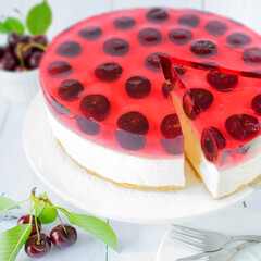 Cheesecake with white chocolate and cherries. Homemade jelly cake with fresh fruit.