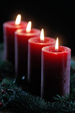 Natural Advent wreath or crown with four burning red candles, Christmas composition, France