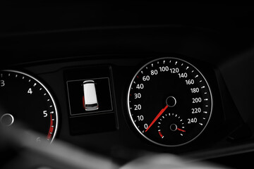 Naklejka premium Modern speedometer, tachometer and open door warning sign on car dashboard