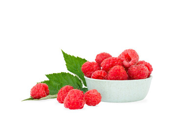 Raspberries in a green bowl isolated on a white background